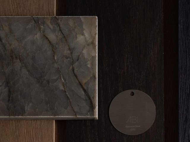 Dark oak and stone samples catching the light