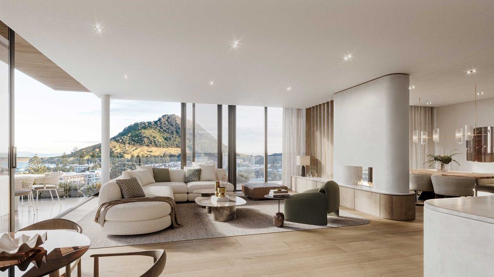 Residence living room with wide oak floors and full-height windows looking out to Mauao