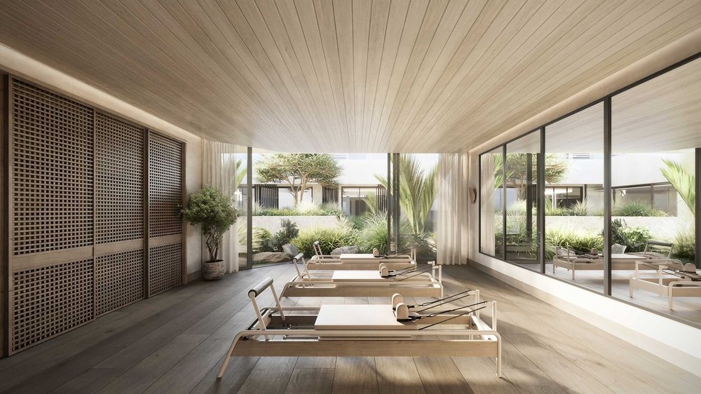 Studio with wide oak floorboards, a timber-lined ceiling and a garden view